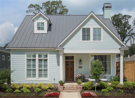 yellow house with charcoal metal roof|metal roof color schemes.